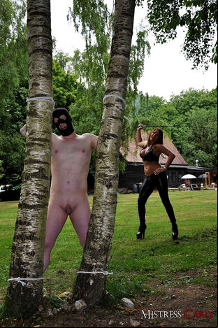Nymph dom Mistress Carly binds hubby up in the yard to